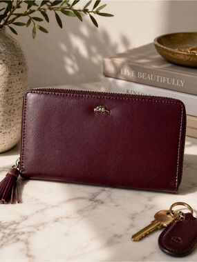 Roots Genuine Leather Zip Around Wallet Burgundy with Tassel & Beaver Charm